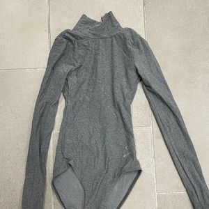 Comfortable open back, high neck leotard.